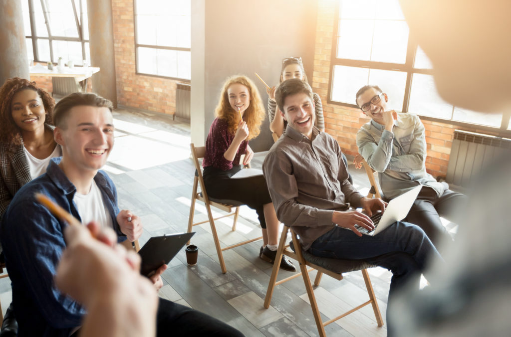 Business Management: Interesting workshop. Laughing audience listening to speaker, copy space